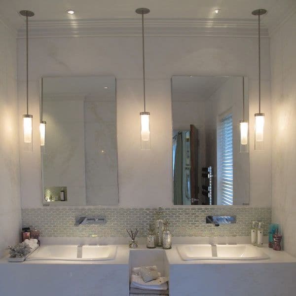 Pendant lights by bathroom mirrors